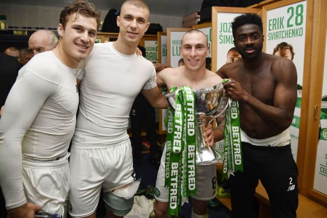 From left, Erik Sviatchenko, Jozo Simunovic, Scott Brown and Kolo Toure celebrate after Celtic's Betfred Cup final victory on Sunday