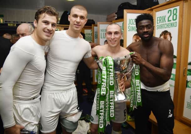 From left,  Erik Sviatchenko, Jozo Simunovic, Scott Brown and Kolo Toure celebrate after Celtic's Betfred Cup final victory on Sunday