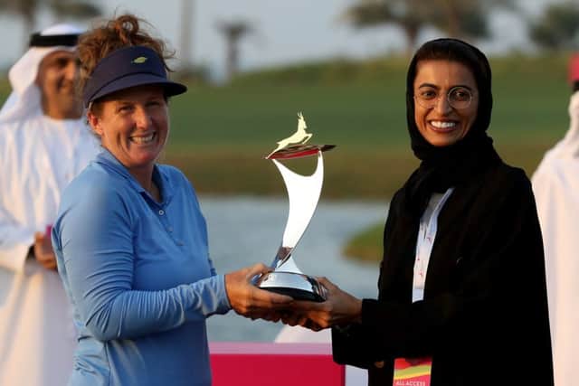 Beth Allen is presented with the  Fatima Bint Mubarak Ladies Open trophy by Her Excellency Noura Al Kaab, UAE Minister of State for Federal, and National Council Affairs. Picture: Francois Nel/Getty Images