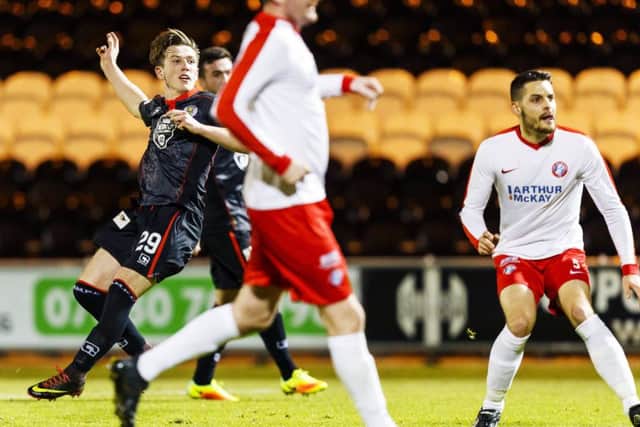 Kyle McAllister, left, scores St Mirrens third goal against Spartans last night. Picture: SNS.