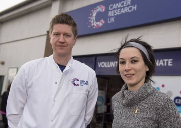 Cancer survivor Florencia Pistritto, 30, of Edinburgh, who was chosen to cut the ribbon to launch Scotland's first Cancer Research UK superstore earlier this year at Corstorphine, and cancer scientist Dr John Thomson.