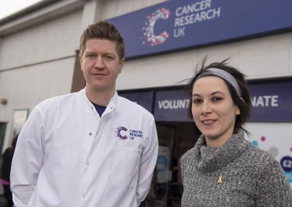 Cancer survivor Florencia Pistritto, 30, of Edinburgh, who was chosen to cut the ribbon to launch Scotland's first Cancer Research UK superstore earlier this year at Corstorphine, and cancer scientist Dr John Thomson.
