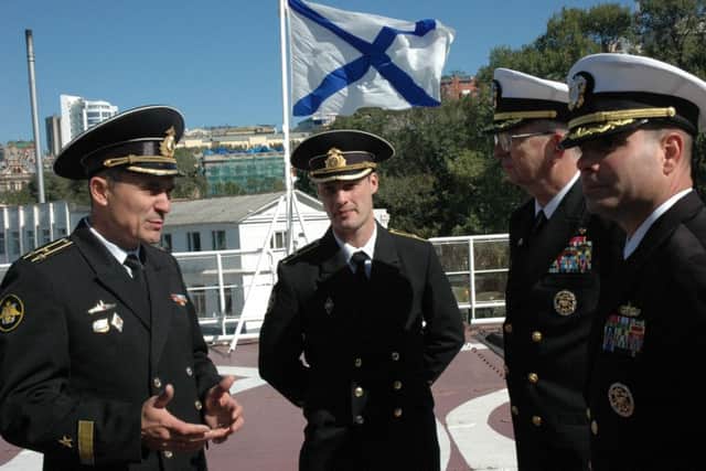 Russian naval officers meet their US counterparts, as a saltire - the symbol of the Russian navy for three centuries - flies in the background. Picture: Wikicommons