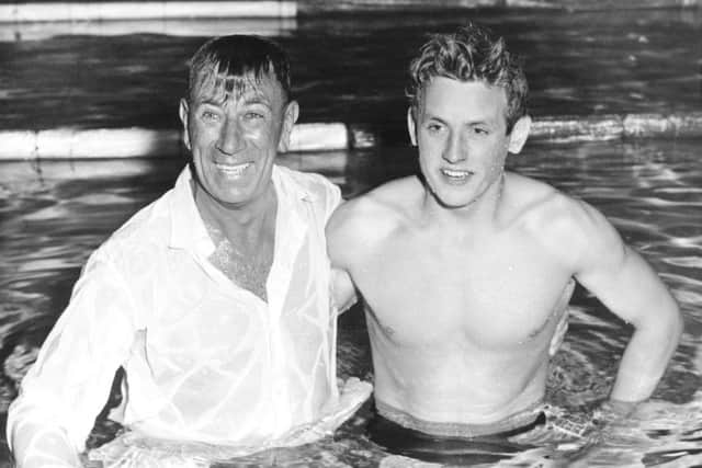 Ian Black (right) is joined in the pool by his coach Andy Robb after winning the 220 yards butterfly at the 1958 Commonwealth Games in Cardiff. Picture: Getty