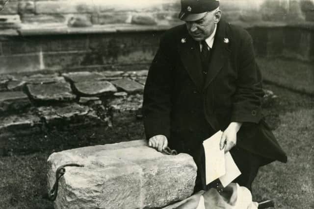 The very first picture taken of the Stone of Destiny when it was returned to Arbroath Abbey in April 1951. The Stone is seen in the care of James Wishart, custodian of the Abbey who received it from Councillors Thornton and Gardiner, intermediaries between the persons who had retrieved the Stone in London and kept it hidden since Christmas Eve 1950. PIC Johnston Press