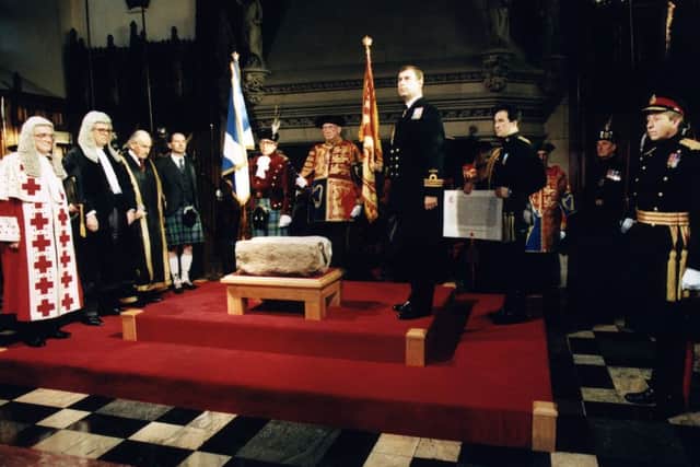 Prince Andrew standing beside the Stone of Destiny at the ceremony in Edinburgh Castle to mark its return. PIC TSPL.