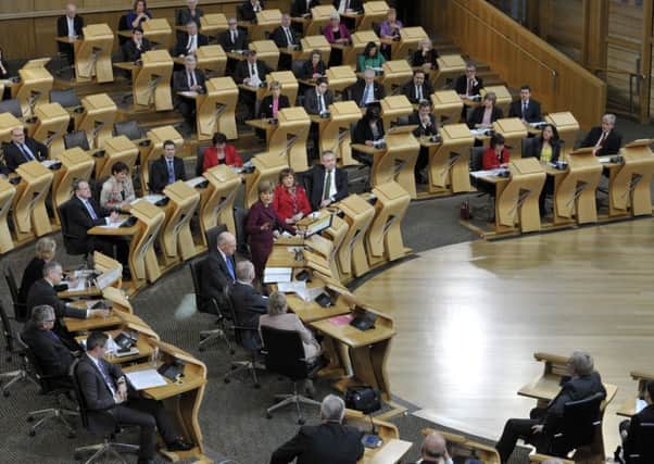 Holyrood may have to increase taxes to avoid the Â£1.3bn spending cuts forecasted. Picture: Ian Rutherford
