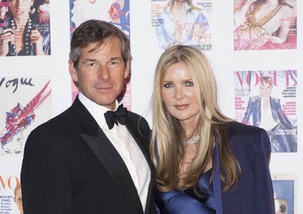 Amanda Wakeley and her business and life partner Hugh Morrison this summer, with Wakeley showcasing her bias-cut evening dresses and tuxedo designs