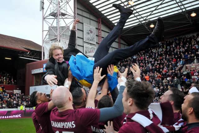 Robbie Neilson with the Hearts squad as the celebrate winning the Scottish Championship title in 2015. Picture: Jane Barlow