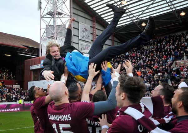 Robbie Neilson with the Hearts squad as the celebrate winning the Scottish Championship title in 2015. Picture: Jane Barlow