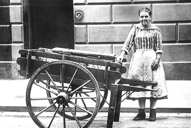Joan Clark, thought to be the last fishwife in St Andrews, wheeled her barrow roundthe streets until the 1920s selling freshly caught fish. She wore the traditional stripedskirt and white apron, red knitted bodice with a shawl, and spotless white stockingswith elastic-sided boots.  PIC Contributed