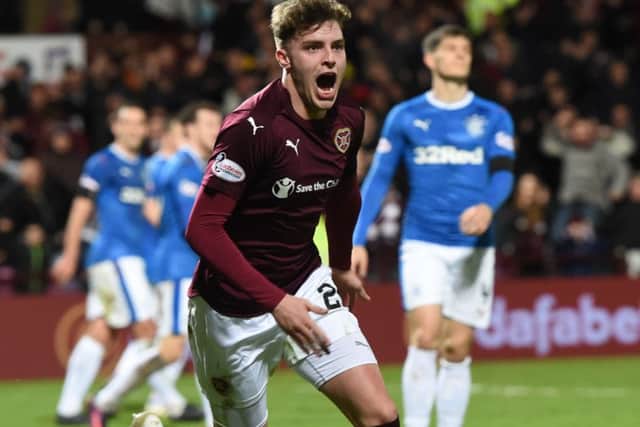 Robbie Muirhead celebrates with after putting Hearts 1-0 ahead. Picture: SNS