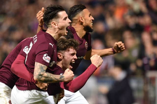The Hearts players celebrate after going 1-0 ahead against Rangers. Picture: SNS