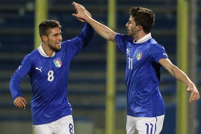 Fausto Rossi, left, playing for the Italian under-20s side. Picture: Getty