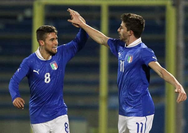 Fausto Rossi, left, playing for the Italian under-20s side. Picture: Getty