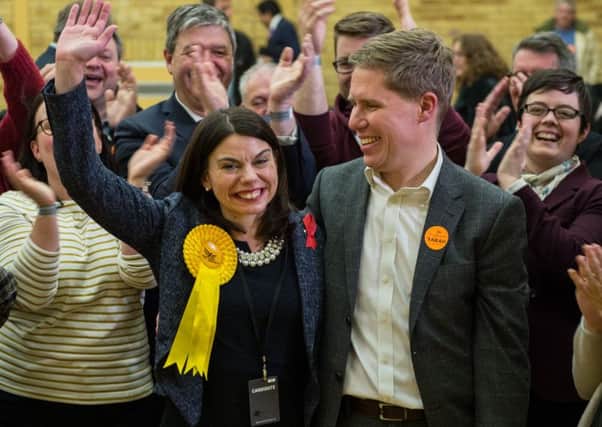 Liberal Democrat candidate Sarah Olney and her husband Ben pose for photos with supporters after being announced as the winner of the Richmond Park by-election. Picture: Chris J Ratcliffe/Getty Images