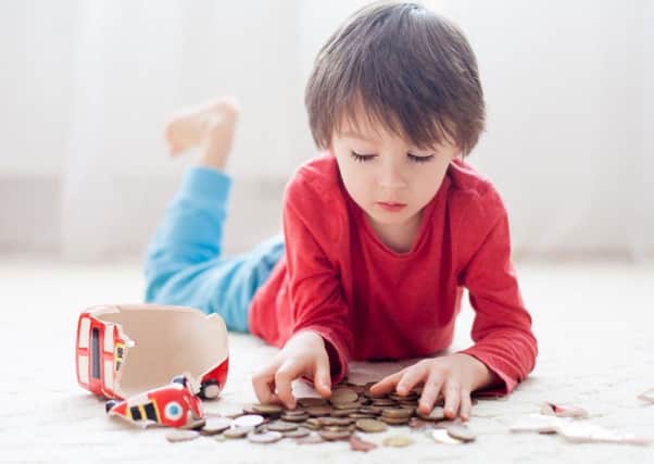 Rather than raiding their whole piggy bank, a small portion of cash could be set aside for a child to spend how they like, helping them to learn about budgets. Photograph: PA