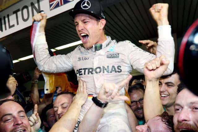Mercedes' Nico Rosberg celebrates winning the World Championship with his wife Vivian after the Abu Dhabi Grand Prix on Sunday. Picture: David Davies/PA Wire