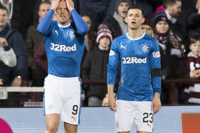 Rangers striker Kenny Miller holds his head in his hands during his side's midweek defeat by Hearts at Tynecastle. Picture: SNS