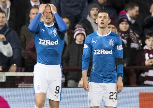 Rangers striker Kenny Miller holds his head in his hands during his side's midweek defeat by Hearts at Tynecastle. Picture: SNS