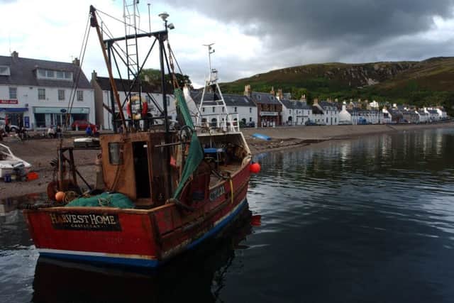 A fishing boat lies idle in the bay of Ullapool. Picture: Jon Savage/TSPL