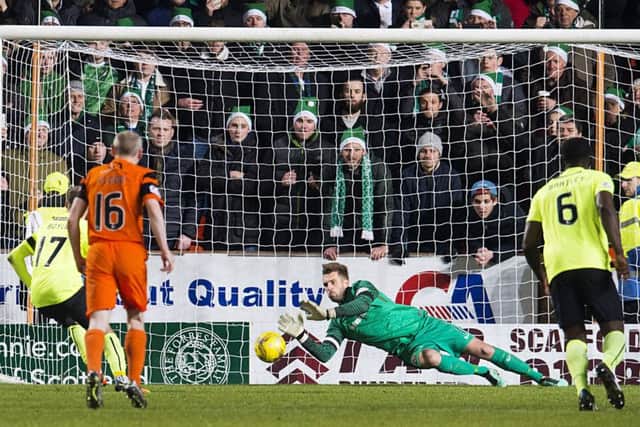 Cammy Bell saves Martin Boyles penalty at Tannadice last nigh. Picture: SNS.