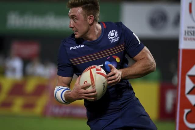 Scotland's Dougie Fife scores a try against Uganda in the Dubai sevens. Picture: Martin Dokoupil/AP