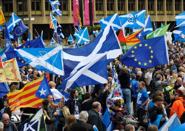 Catalan Esteladas and Saltires at a Glasgow rally. Picture: Getty