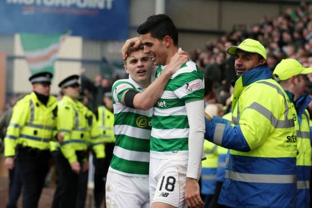 Celtic's Tom Rogic (right) celebrates scoring the winning goal with team-mate James Forrest. Picture: Jane Barlow/PA Wire