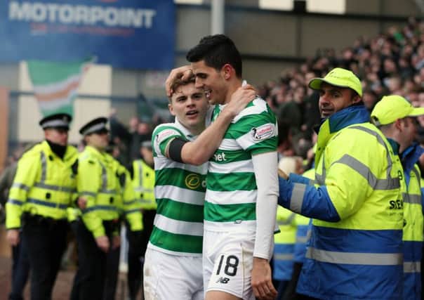 Celtic's Tom Rogic (right) celebrates scoring the winning goal with team-mate James Forrest. Picture: Jane Barlow/PA Wire