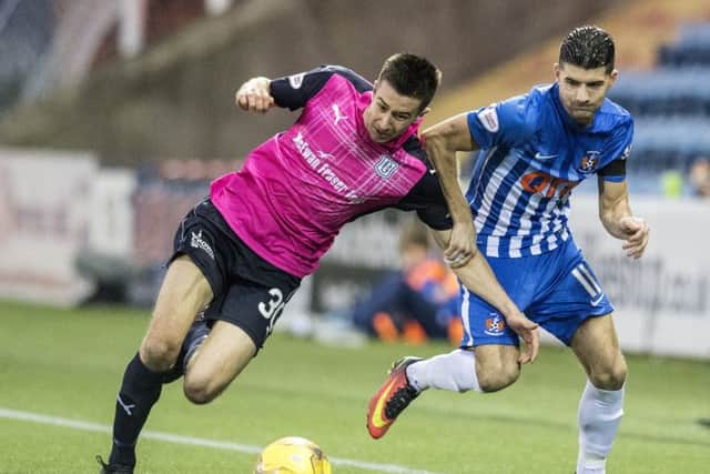 Kilmarnock's Jordan Jones (right) and Dundee's Cammy Kerr battle for possession. Photograph: Ross Parker/SNS