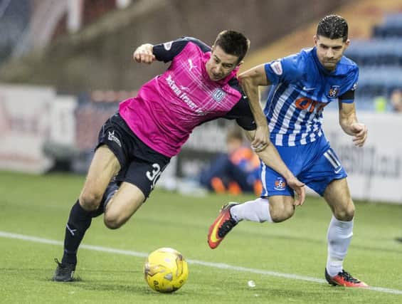 Kilmarnock's Jordan Jones (right) and Dundee's Cammy Kerr battle for possession. Photograph: Ross Parker/SNS