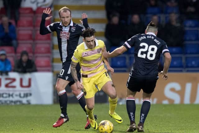 Left to righ: Ross County's Liam Boyce, Hearts' Jamie Walker and Kenny Van Der Weg battle for the ball. Picture: Gary Hutchison/SNS