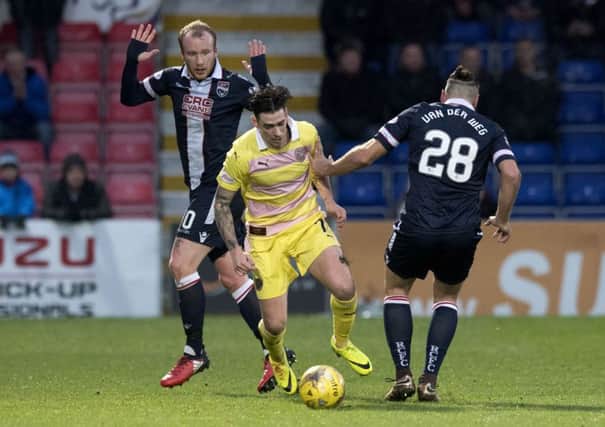 Left to righ: Ross County's Liam Boyce, Hearts' Jamie Walker and Kenny Van Der Weg battle for the ball. Picture: Gary Hutchison/SNS
