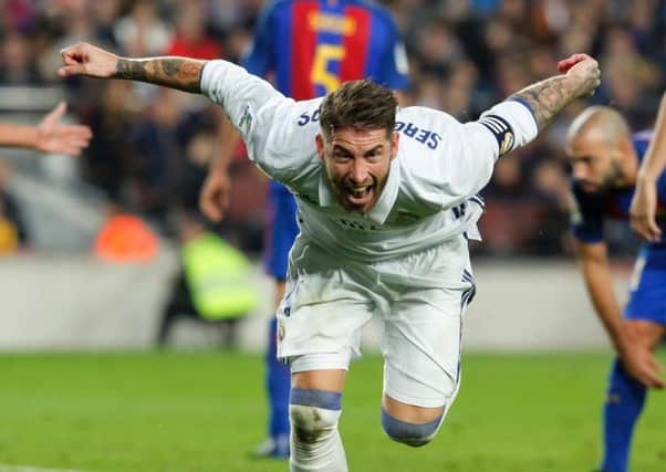 Real Madrid's Sergio Ramos celebrates his late equaliser against Barcelona. Picture: Pau Barrena/AFP/Getty Images