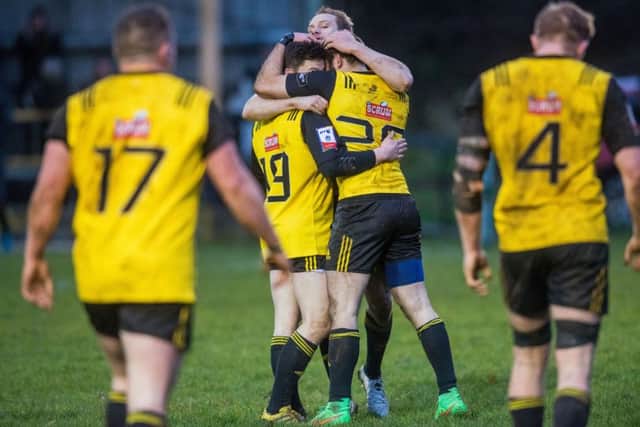 Melrose's players celebrate their win over Currie. Pic: Ian Georgeson