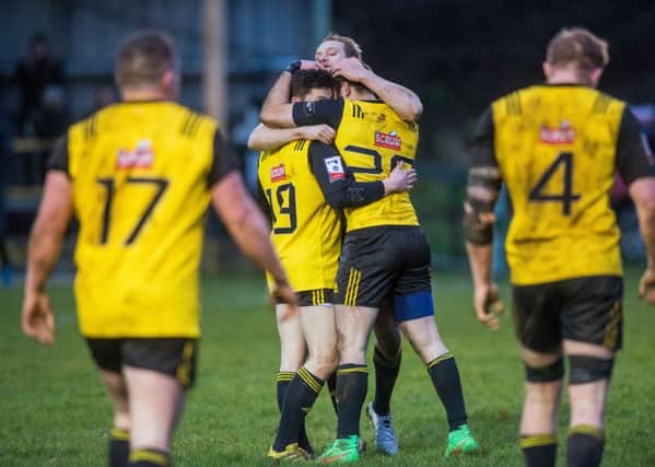 Melrose's players celebrate their win over Currie. Pic: Ian Georgeson