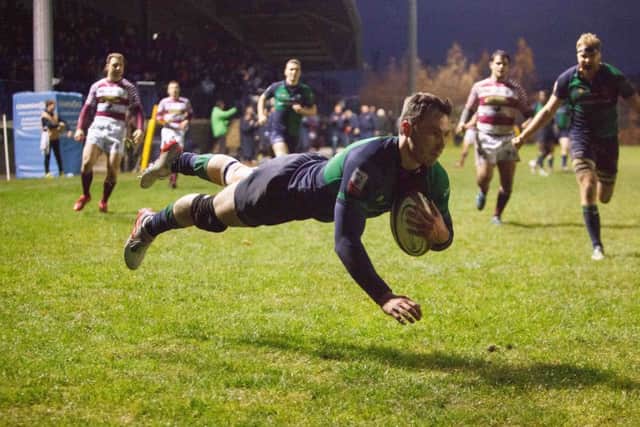 Jordan Edmunds goes over for his hat trick for Boroughmuir. Picture Toby Williams