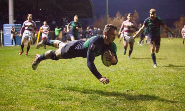 Jordan Edmunds goes over for his hat trick for Boroughmuir. Picture Toby Williams