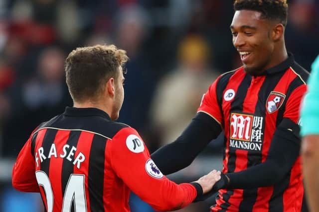 Ryan Fraser, left, celebrates with Jordan Ibe after scoring Bournemouth's second goal against Liverpool. Picture: Getty