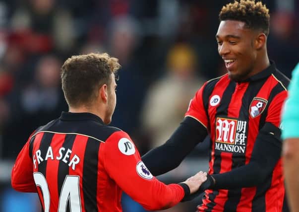 Ryan Fraser, left, celebrates with Jordan Ibe after scoring Bournemouth's second goal against Liverpool. Picture: Getty
