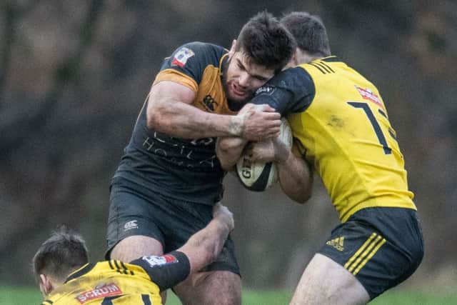 Robbie Nelson (centre) tries to fend off Craig Jackson and Nyal Godsmark. Picture: Ian Georgeson.
