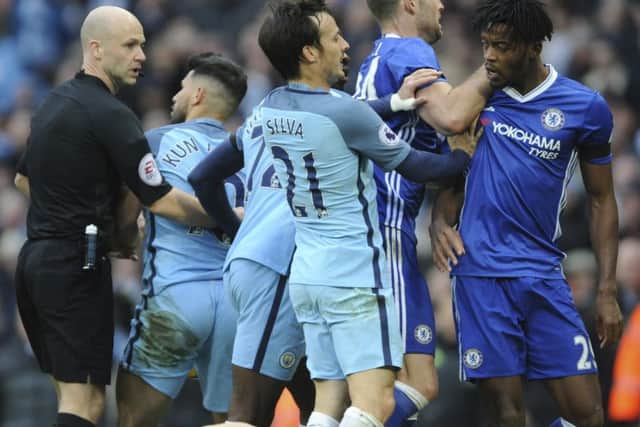 Sergio Aguero (second left) is sent off by referee Anthony Taylor. Picture: AP/Rui Vieira.