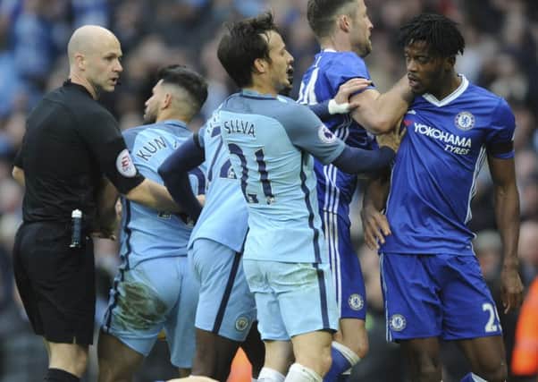 Sergio Aguero (second left) is sent off by referee Anthony Taylor. Picture: AP/Rui Vieira.