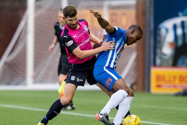 Kilmarnock striker Souleymane Coulibaly, right, is pressed by Dundees Kostadin Gadzhalov. Picture: SNS.