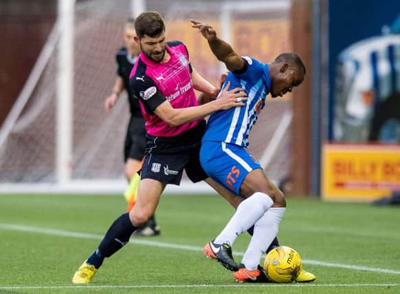 Kilmarnock striker Souleymane Coulibaly, right, is pressed by Dundees Kostadin Gadzhalov. Picture: SNS.