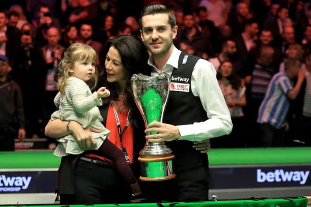 Mark Selby celebrates winning the Betway UK Championship with his daughter Sofia Maria and wife Vikki Layton. Picture: Mike Egerton/PA Wire