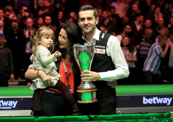 Mark Selby celebrates winning the Betway UK Championship with his daughter Sofia Maria and wife Vikki Layton. Picture: Mike Egerton/PA Wire