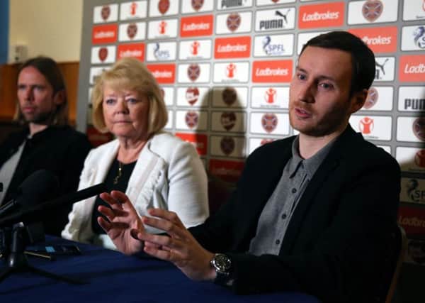 Ian Cathro (right) speaks at his opening press conference as Hearts boss. Picture: PA