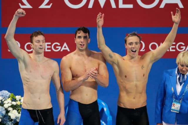 Daniel Wallace, Calum Jarvis and Robert Renwick (right) of Great Britain react after winning the gold medal in the Men's 4x200m Freestyle Relay final at the FINA World Championships in Kazan, Russia. Picture: Adam Pretty/Getty Images